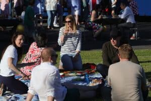 A group of people enjoying a sunny outdoor event at Inchmarlo estate in Aberdeenshire.