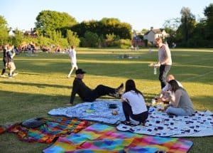 Families enjoying a picnic in Inchmarlo park on a sunny day.