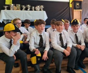 Students in school uniform at Inchmarlo, engaged in classroom activity.