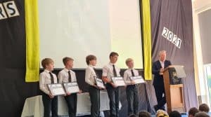 Students receiving awards at Inchmarlo school event, showcasing academic excellence and student achievements.