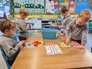 Young children engaging in classroom activities at Inchmarlo School.