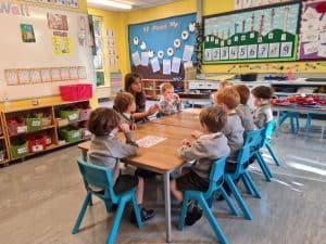 Young children engaged in classroom activity at Inchmarlo.