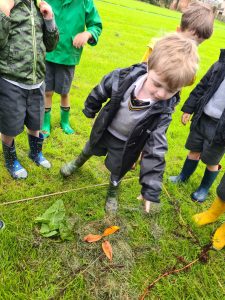 Children exploring outdoor nature activities at Inchmarlo.