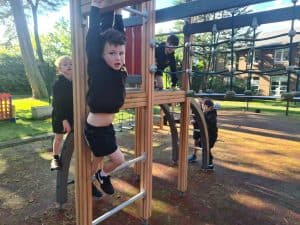 Children enjoying outdoor play at Inchmarlo, a family-friendly location with vibrant playgrounds.