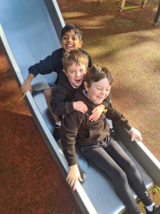 Children having fun on a playground slide at Inchmarlo.