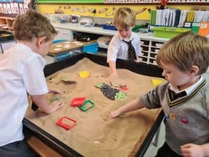 Children playing in sandpit at Inchmarlo School.