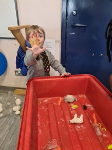 Child playing with sensory toys at Inchmarlo child care center.