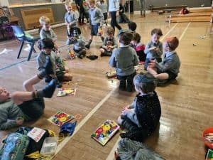 Children playing and engaging in activities at Inchmarlo community event.