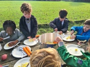 Children enjoying outdoor meal at Inchmarlo, a family-friendly Scottish estate and luxury hotel.