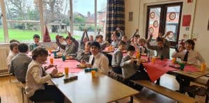 Engaging classroom scene at Inchmarlo School with students and teacher during lesson.