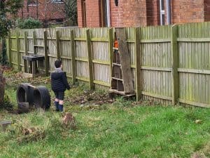 Child playing in an outdoor garden at Inchmarlo residential care home.