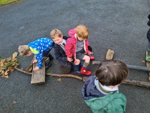 Children playing outdoors at Inchmarlo, a scenic woodland setting in Aberdeenshire.