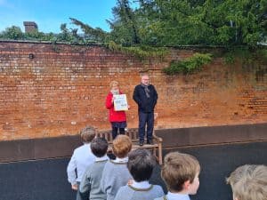 Outdoor event at Inchmarlo, featuring speakers and community engagement in a scenic setting.