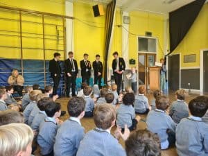Students and teachers in a school assembly at Inchmarlo, showcasing a vibrant learning environment.
