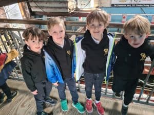 Young children visiting Inchmarlo in Scotland, enjoying educational activities.