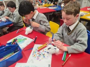 Children engaging in creative arts and crafts activities.