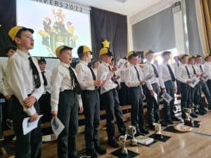 Students in uniform receiving awards on stage at Inchmarlo School.