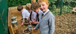 Students engaging in outdoor learning activities at Inchmarlo School.