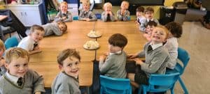 Children enjoying a meal in Inchmarlo school dining hall.