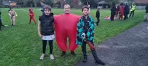 Children enjoying outdoor activities at Inchmarlo school event.