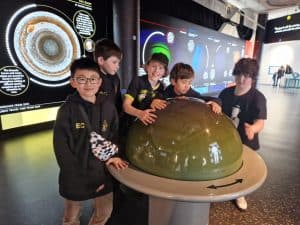 Children exploring interactive science display at Inchmarlo Educational Center.
