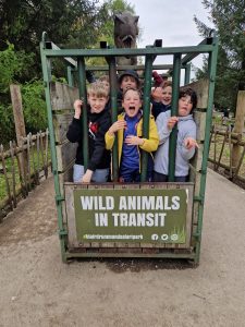 Kids enjoying an exciting wildlife train ride at Inchmarlo with wild animals in transit theme.
