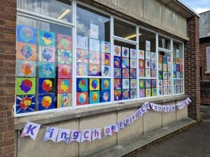 Colorful children's artwork display at Inchmarlo preschool or community center.