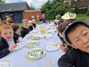 Children enjoying a festive outdoor meal at Inchmarlo estate.