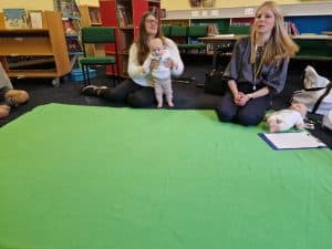 Children and educator participating in indoor activities at Inchmarlo.