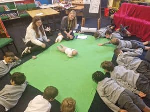 Students engaging in interactive learning activities at Inchmarlo School.