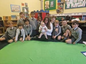 Group of children in a classroom at Inchmarlo School, engaged in educational activities.