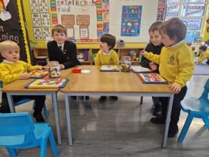 Young children engaging in classroom activities at Inchmarlo preschool.