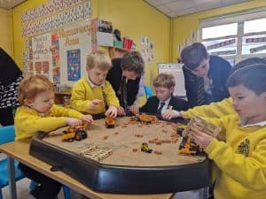 Children playing with toys in Inchmarlo nursery classroom.