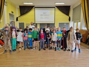 Children participating in outdoor activities at Inchmarlo school, emphasizing community and education.