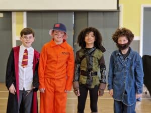 Children in colorful costumes at Inchmarlo school event in Aberdeenshire.