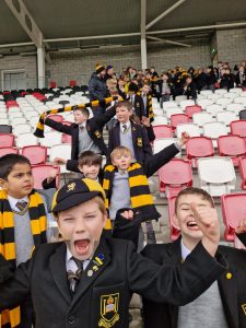 Children excited at Inchmarlo school event in cheer and enthusiasm.
