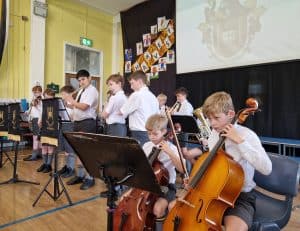 Young musicians perform with their instruments during a concert at Inchmarlo.