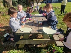 Children enjoying outdoor craft activity at Inchmarlo.