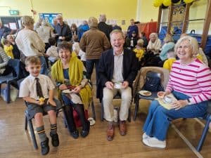 People enjoying a social event at Inchmarlo retirement community in Scotland.