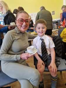 Smiling woman and boy at Inchmarlo event, showcasing community engagement and family-friendly activities.