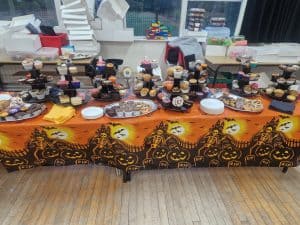 Decorative dessert table with cupcakes and treats at Inchmarlo event.