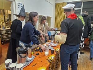 People enjoying a cooking class at Inchmarlo Event, showcasing community activities and culinary experiences.