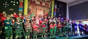 Children's Christmas choir performing at Inchmarlo school event.