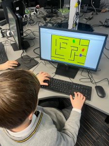 Student working on a gaming project at Inchmarlo educational facility.