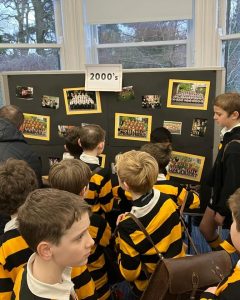 Students exploring historical displays at Inchmarlo School.
