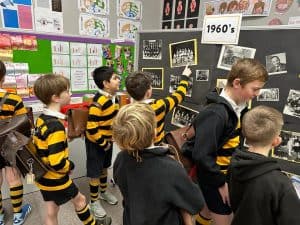 Students exploring historic school displays at Inchmarlo.