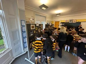 Children exploring Inchmarlo classroom environment with educational displays.