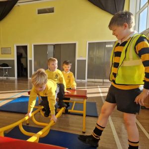 Children engaging in indoor play activities at Inchmarlo educational facility.