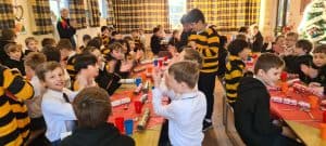 Children enjoying a lively classroom activity at Inchmarlo primary school.