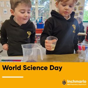 Two children conducting a science experiment at Inchmarlo.